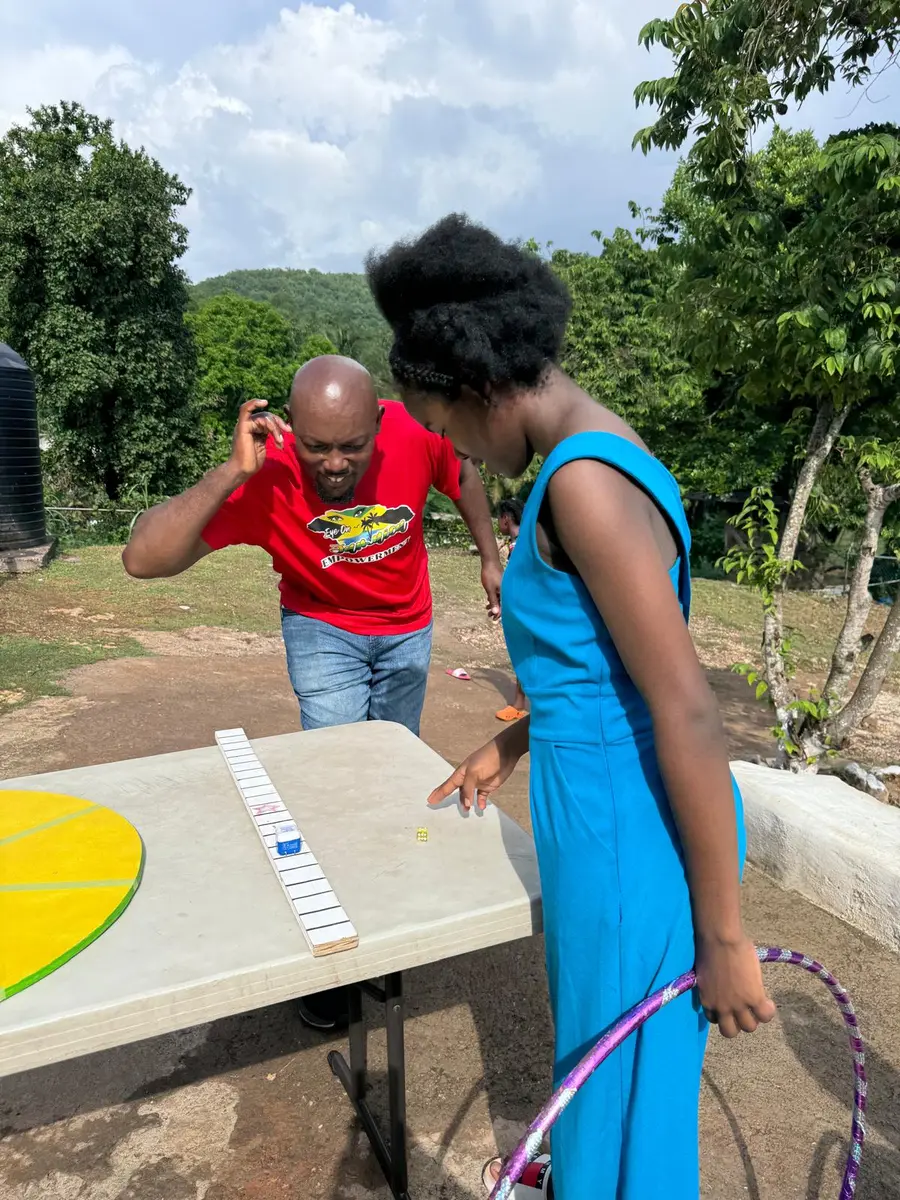 Volunteers leading an outdoor activity with children